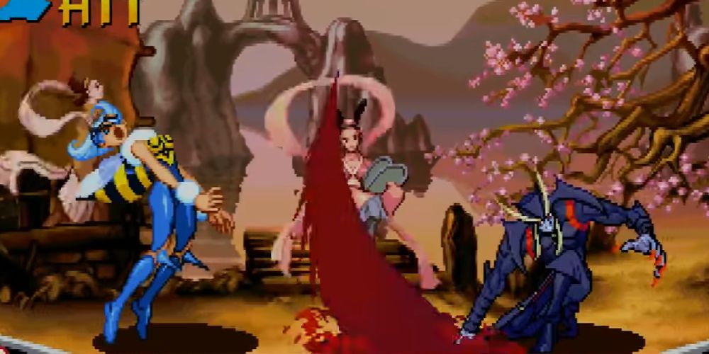 Q. Bee recoils away from Jedah's blood attack