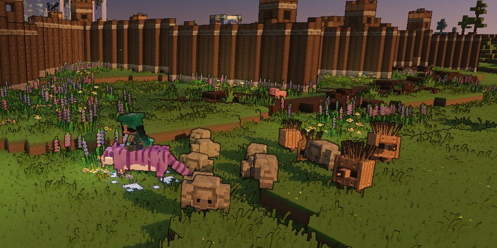 a hero patrols the walls of a village with a group of Cobblestone and Plank Golems in Minecraft Legends