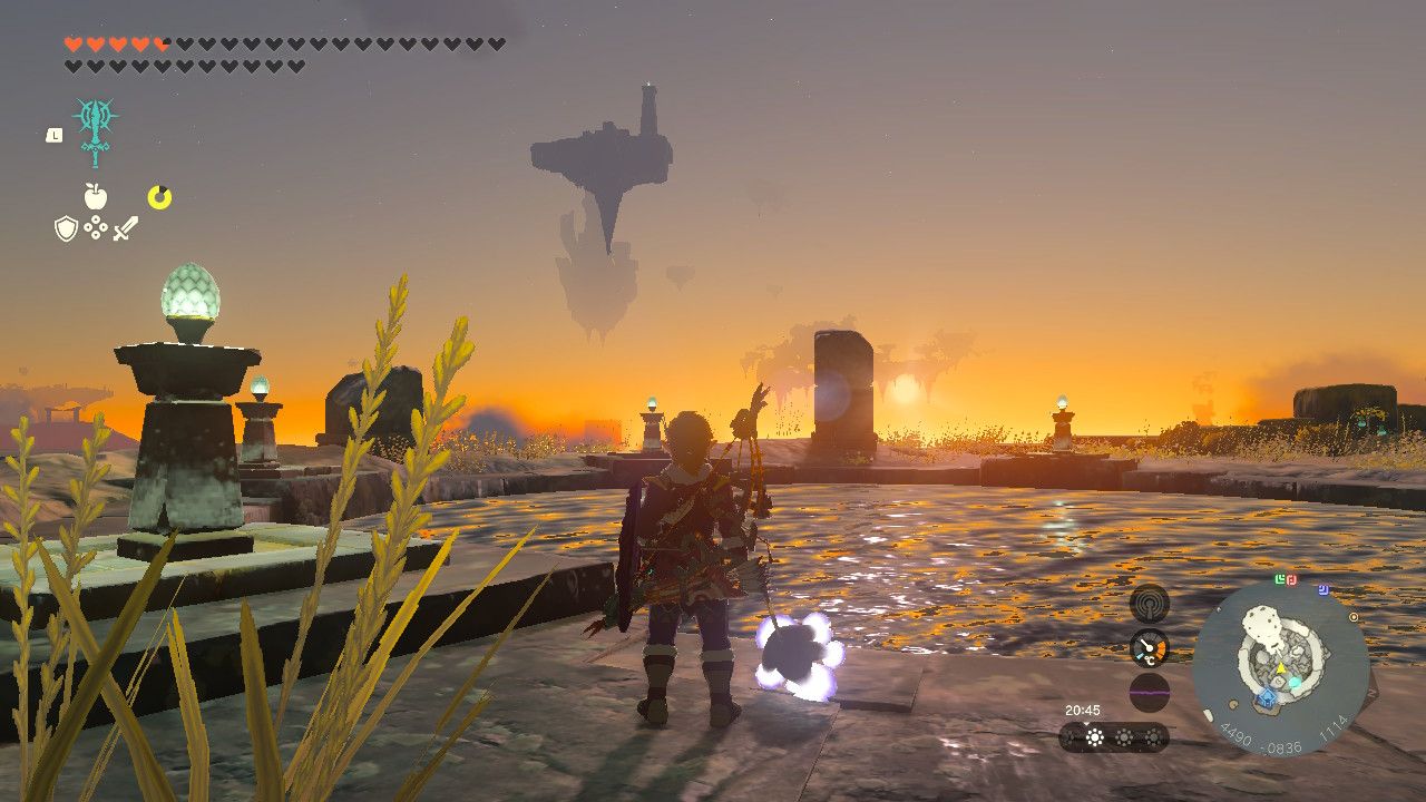 Tears of the Kingdom Valor Island with Link standing by its pool of water at sunset