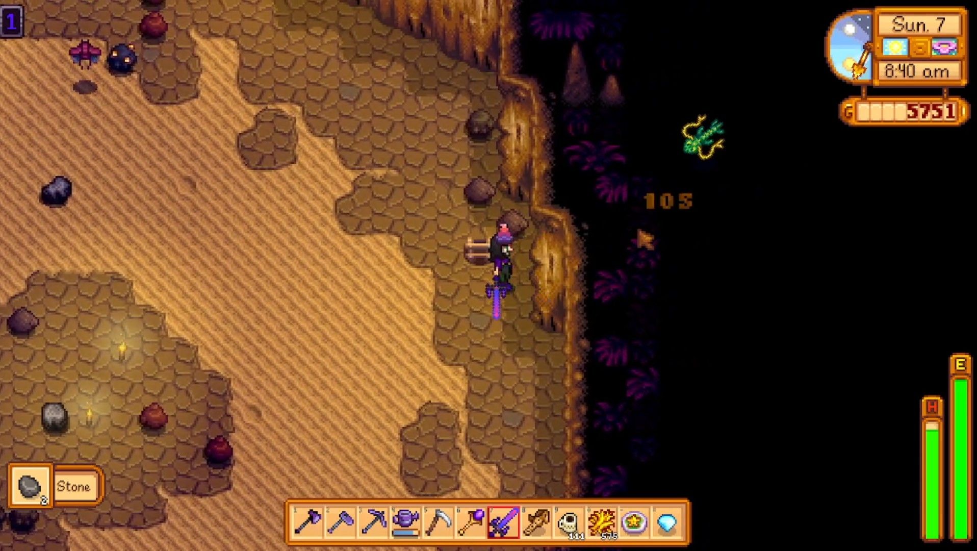 a farmer fighting a serpent with a ladder behind her in stardew valley skull cavern