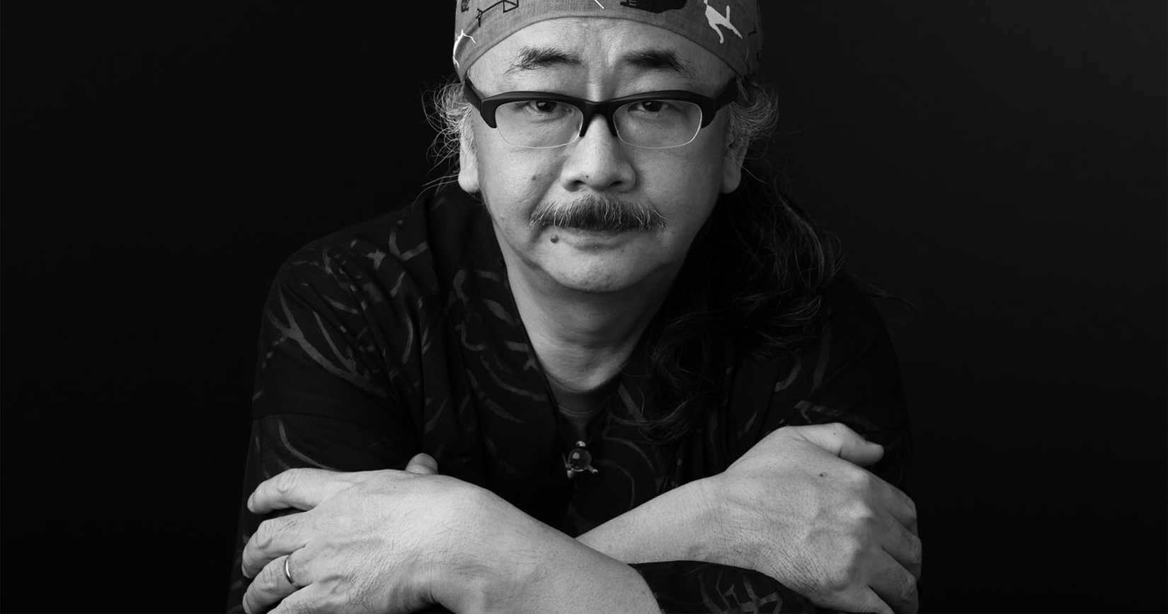 Nobuo Uematsu in a black-and-white photo.