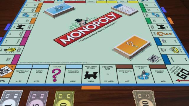 A monopoly board currently being played on.