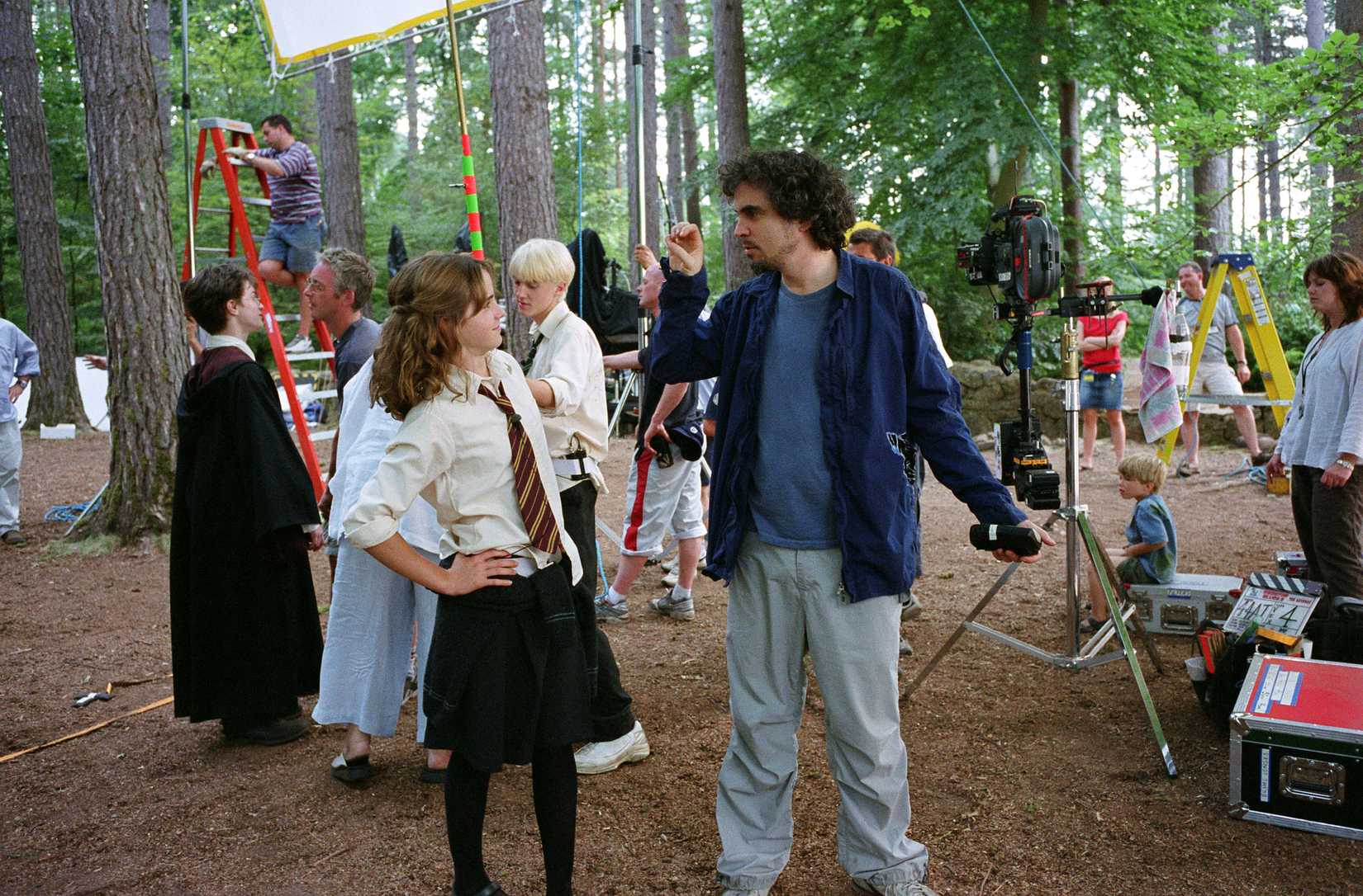 An image of Alfonso Cuaron on set directing Emma Watson during the filming of Prisoner of Azkaban.