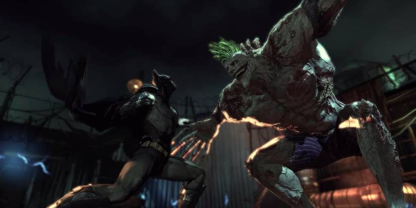 Batman is looking at a mutant joker at Batman Arkham Asylum.