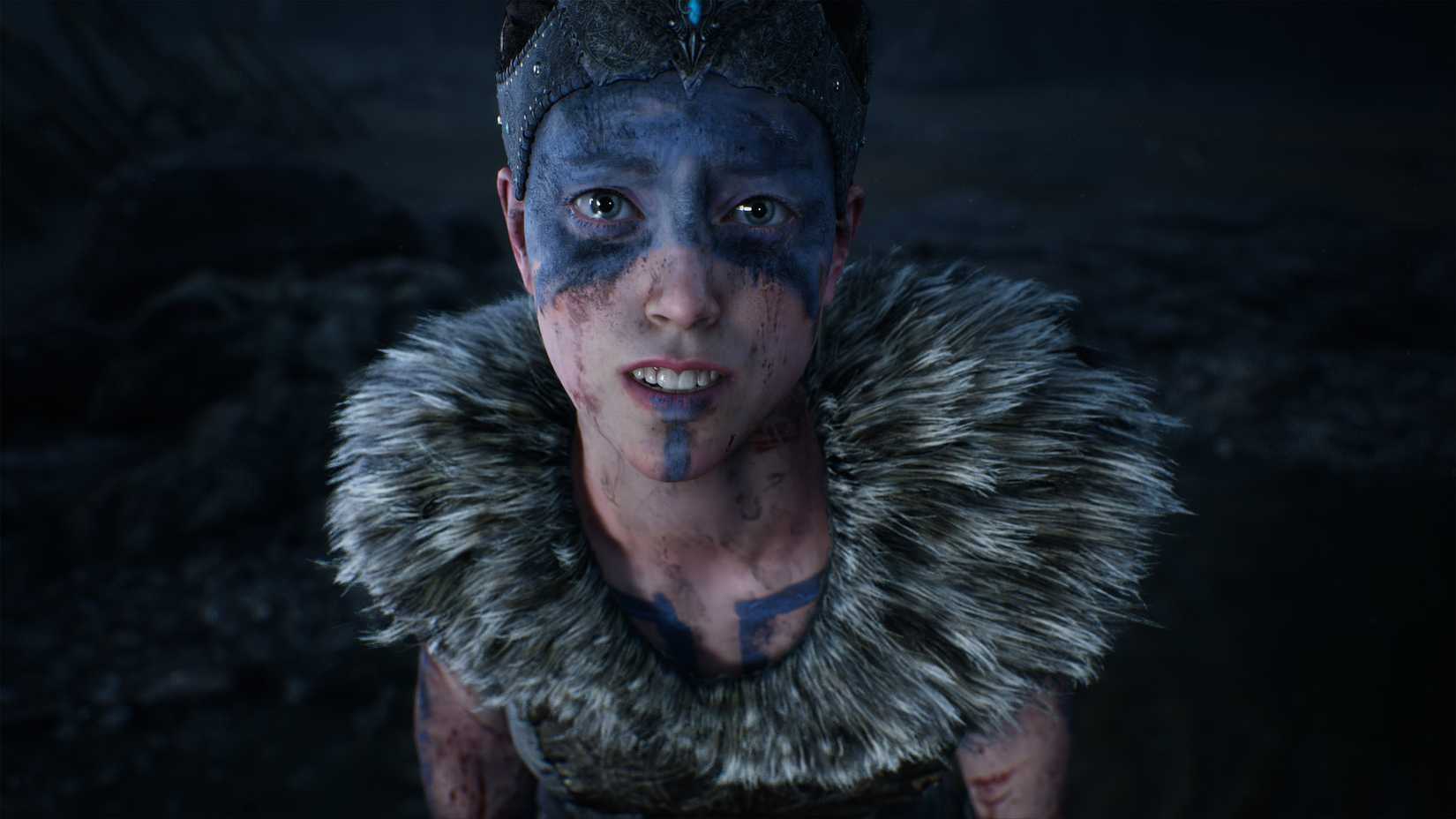 Senua looking into the camera in Hellblade: Senua's Sacrifice.