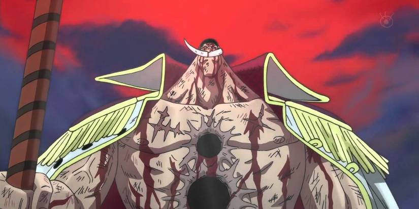Whitebeard dead but standing still, with two huge holes on his chest and plenty of blood over his body.