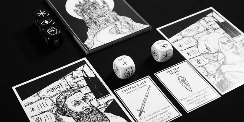 Several cards and dice to avoid the dark castle on the table. 