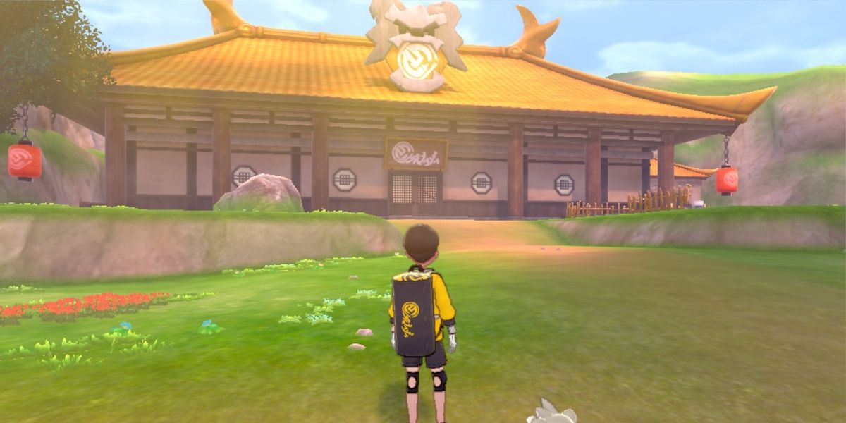 a screenshot of a player character in pokemon sword and shield walking past the Master Dojo.