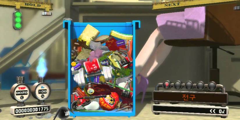 Trash can full of various broken items
