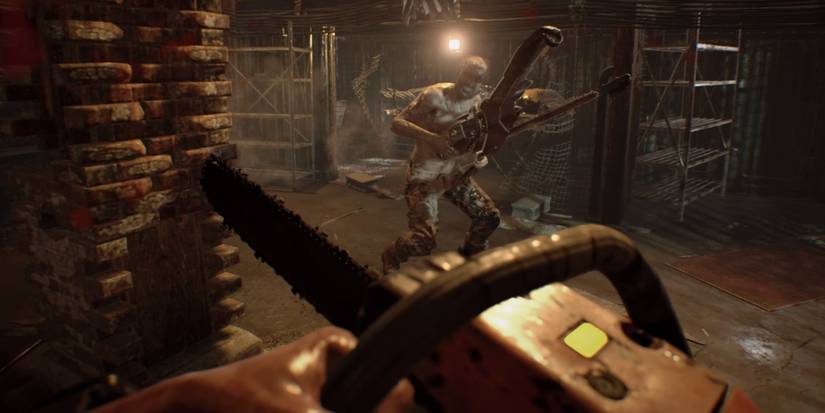 A screenshot showing a combat encounter with chainsaws between Ethan and Jack Baker in the garage.