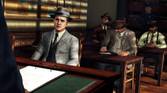 Cole Phelps and talking to a police offer as other offers sit and take notes or listen in