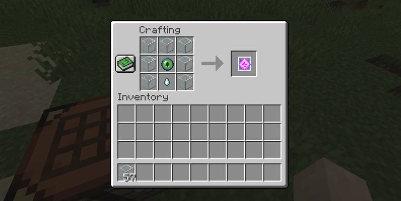 player at crafting table with material set up to create an end crystal