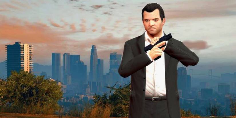 Grand Theft Auto 5 screenshot of Michael de Santa holding pistol in front of downtown Los Santos.