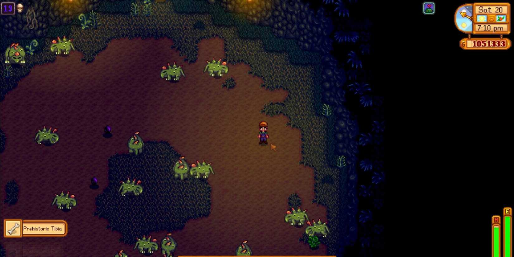 player standing in mines with dinosaurs and monster musk buff