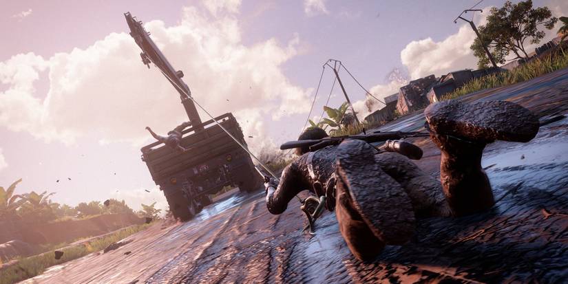 A screenshot showing Nate being pulled through the mud in Uncharted 4: A Thief's End