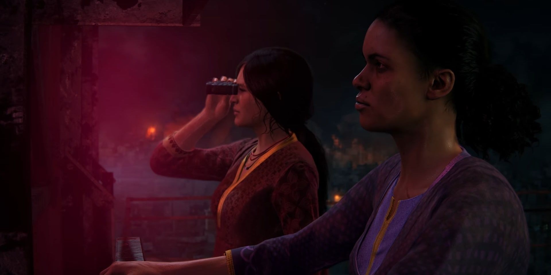 Chloe and Nadine by a neon sign in Uncharted: A Lost Legacy