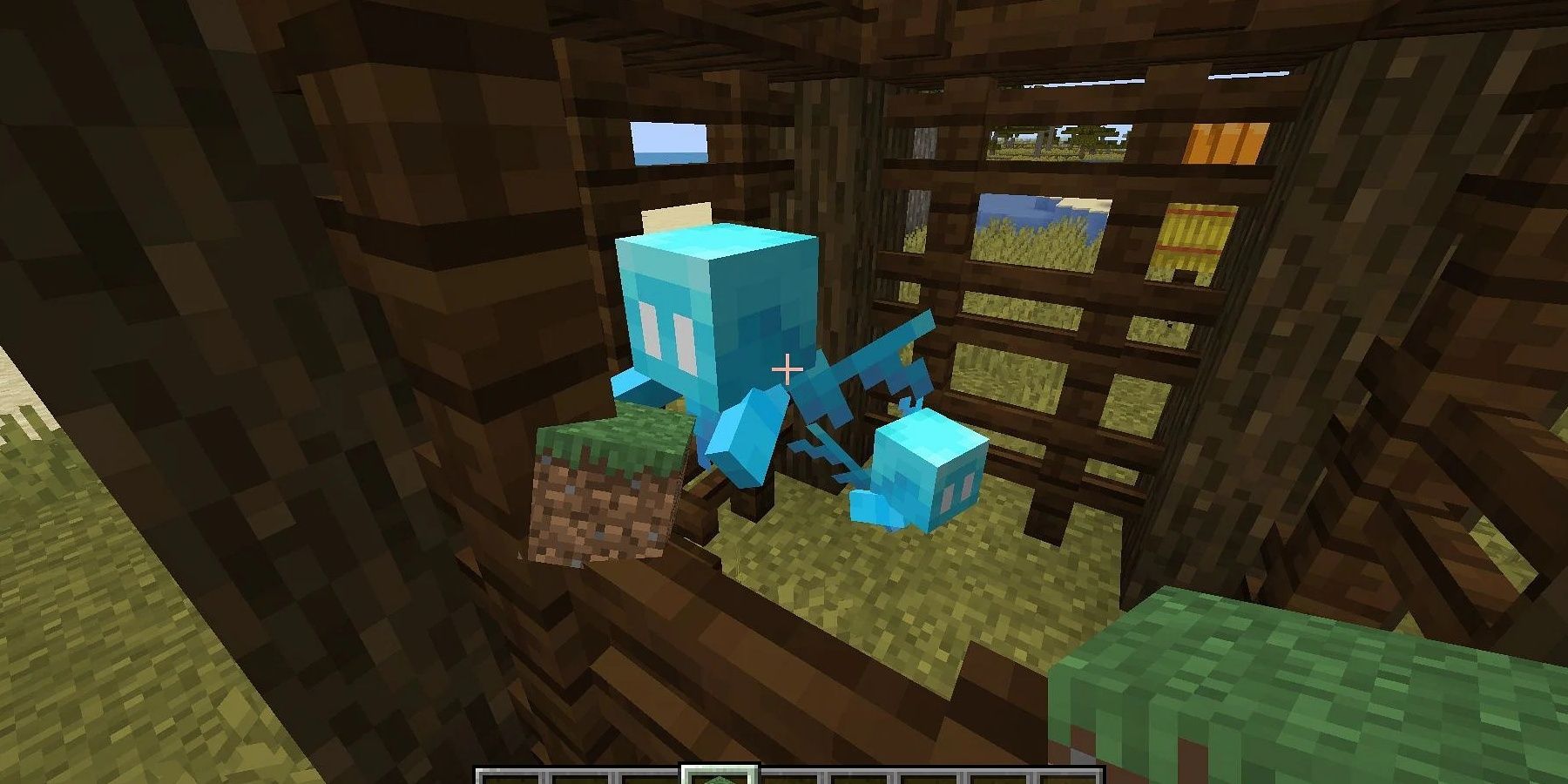 Allay trapped in Minecraft at the Pillager Outpost prison holding a grass block 