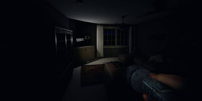 player enters darks house and looks at tv screen displaying tutorial instructions