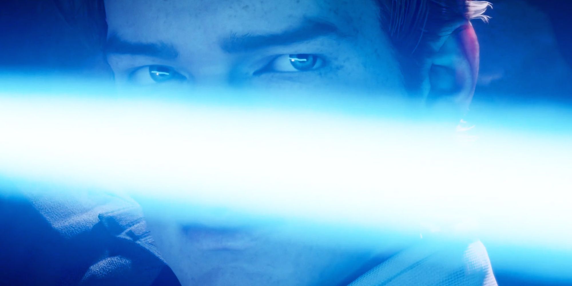 Cal Kestis close up with a lightsaber horizontally across his face