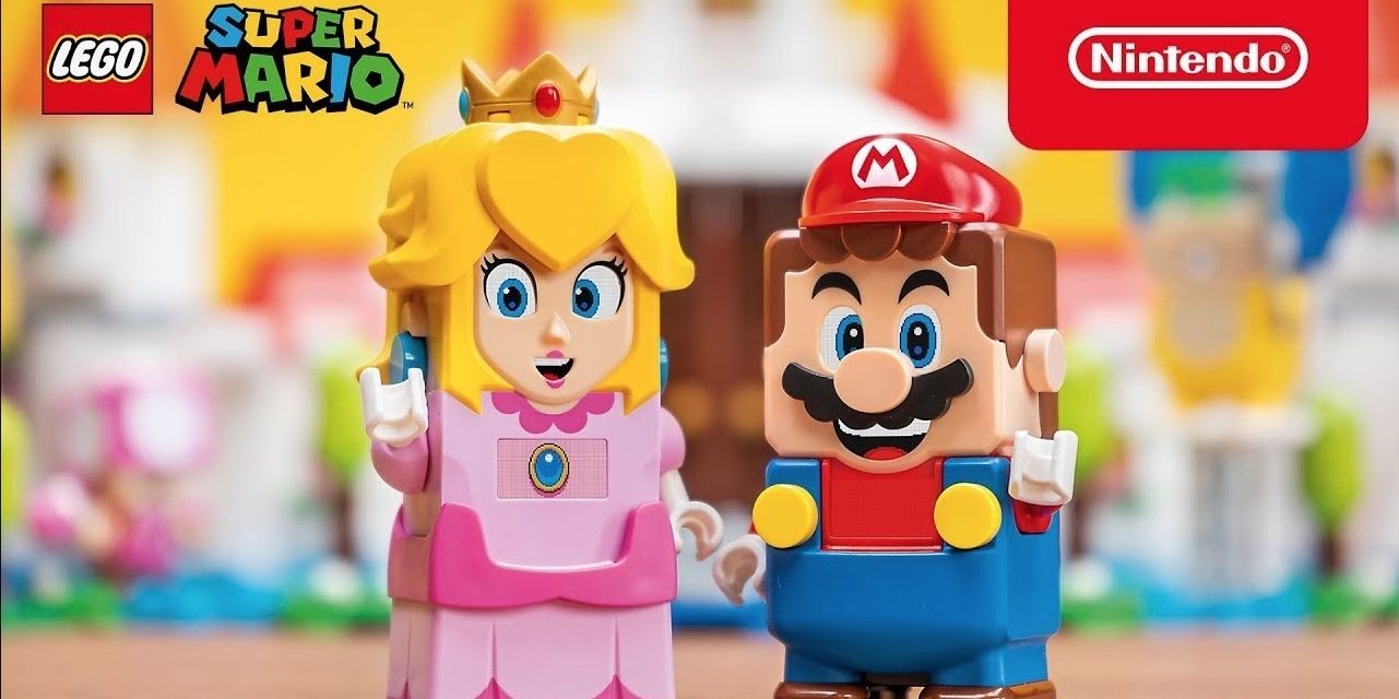 Lego Peach and Mario standing in front of a blurry castle set