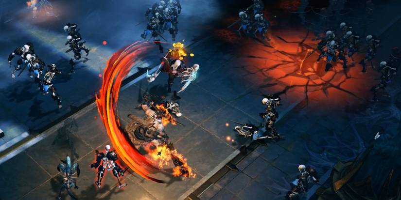 Combat happening in an arena in the mobile Diablo: Immortal, a fire swipe attack incoming on enemies. 