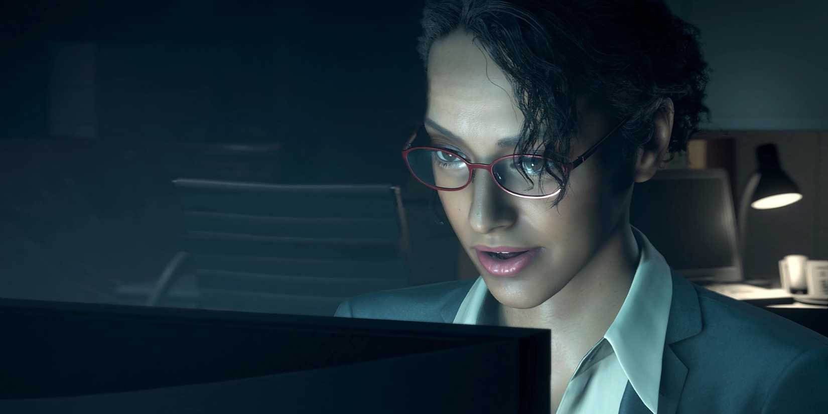 Ingrid Hunnigan looks at a computer screen in Resident Evil 4 Remake.