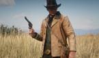 A Mod For Red Dead Redemption 2 that updates the graphics of Arhtur's gunslinger coat, with a photo that showcases Arthur wearing the tan coat in a field.
