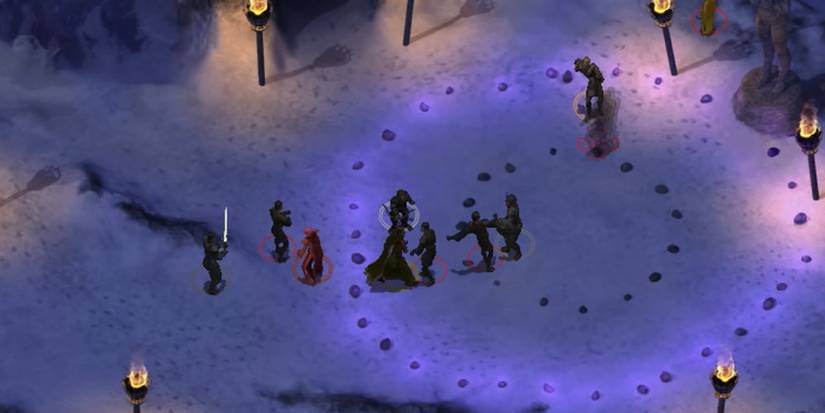 Baldur's Gate Enhanced Edition, which shows players fighting creatures in the snow.