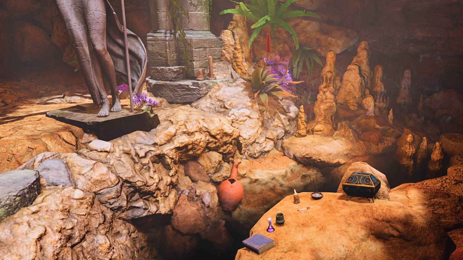 A screenshot showing the inside of the Owl Bear cave, with some treasure on the ground.