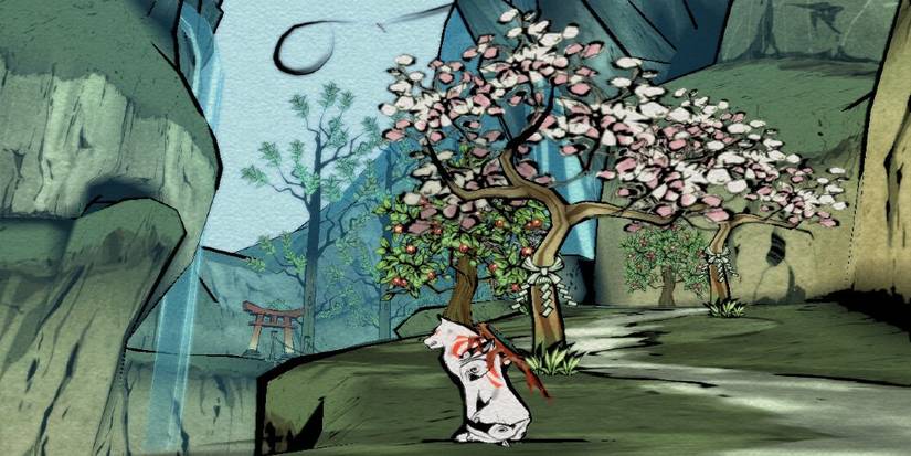 Amaterasu sits peacefully in front of Okami's cherry blossom trees and waterfall.