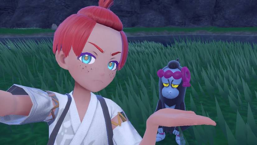 Pokemon Scarlet & Violet Teal Mask player posing with Munkidori.