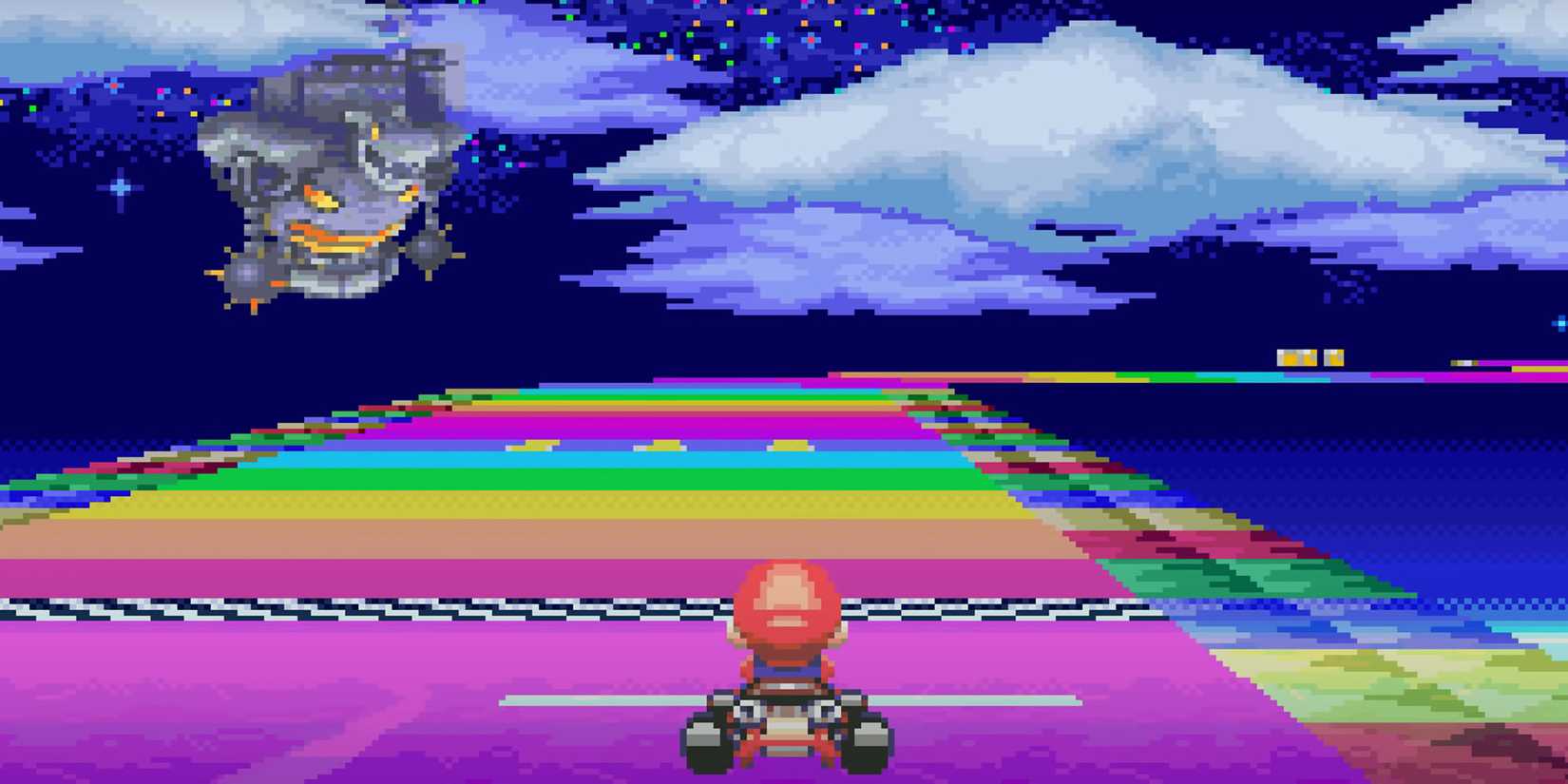 Mario Kart Super Circuit - Mario racing down rainbow road while Bowser's Castle lingers in the background