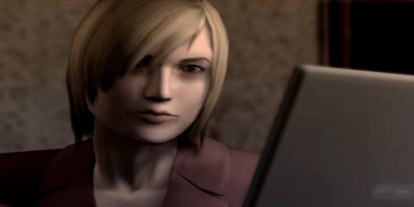 Alyssa Ashcroft looking at a laptop in Resident Evil: Outbreak.