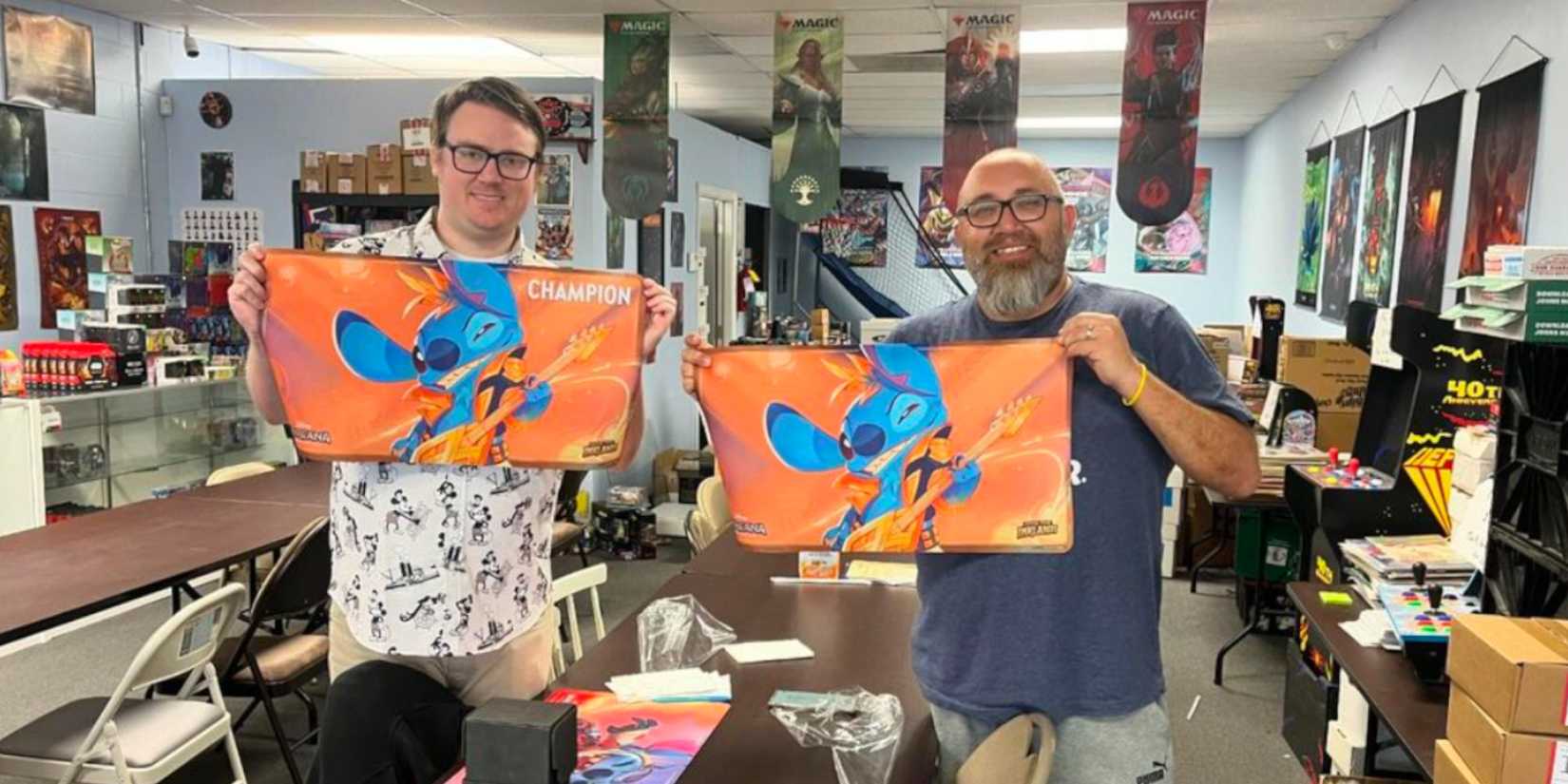 eric switzer with a stich mat at atomic comics lorcana