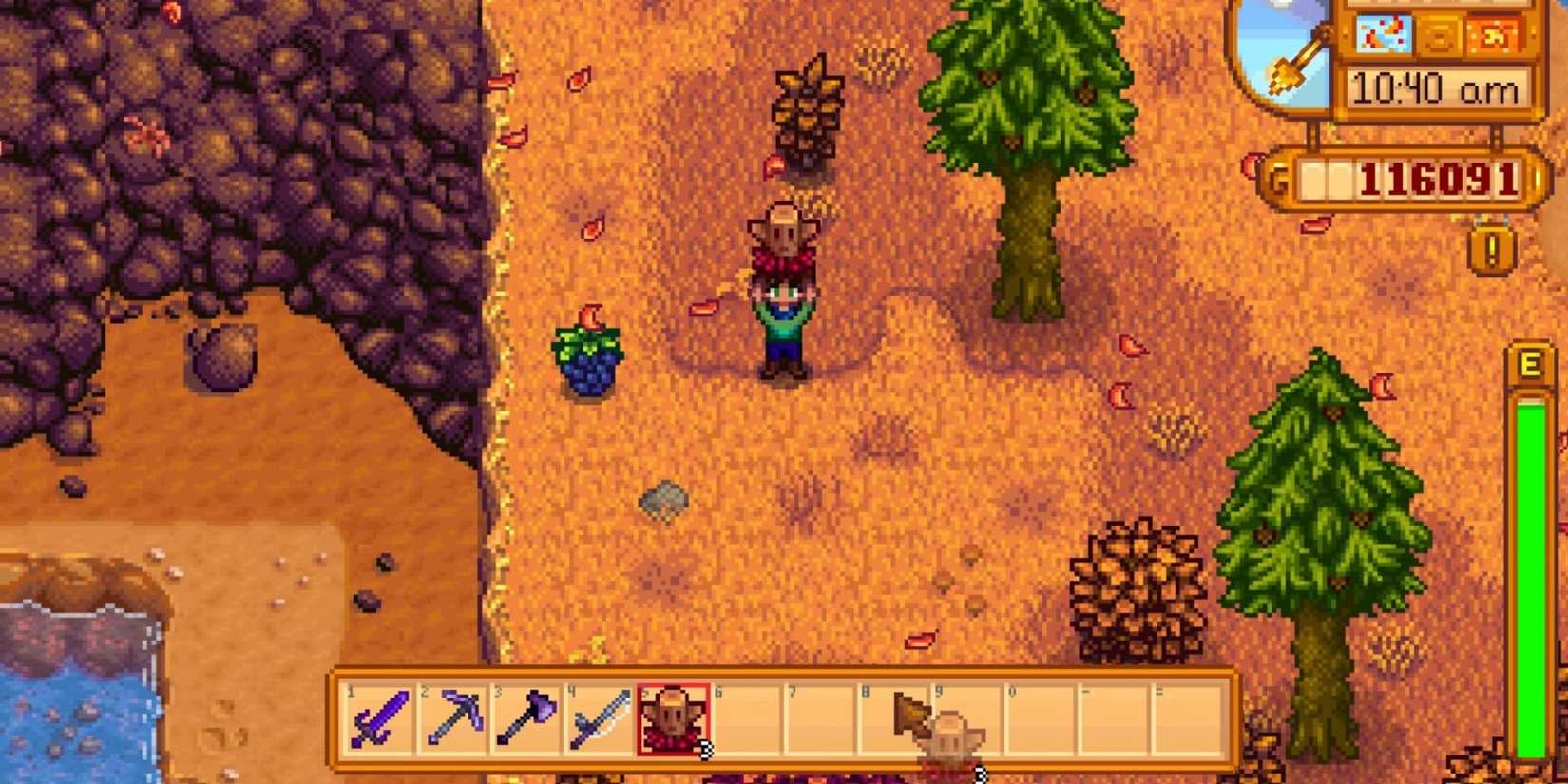 A farmer in the forest holding a Warp Totem for The Mountain.