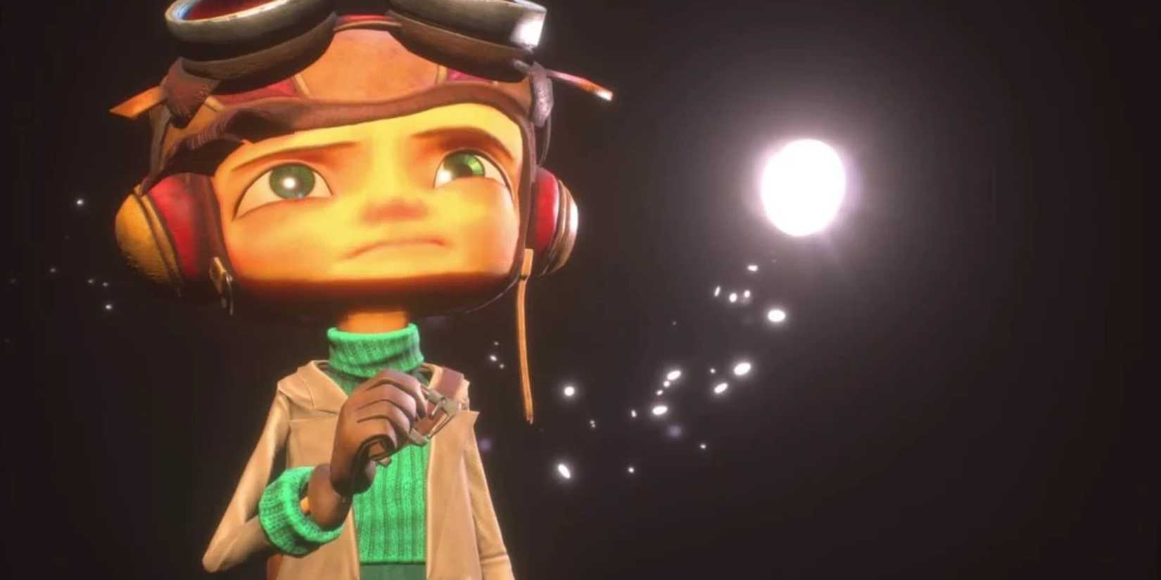 Raz in Psychonauts 2 stands with a sad expression in the dark. 