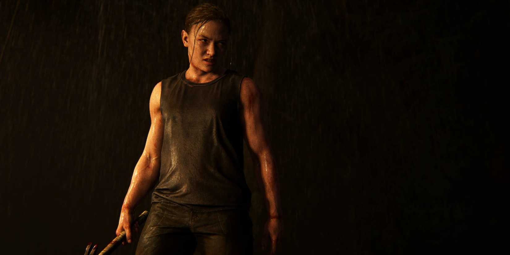 Abby holding a hammer with an intense expression in The Last of Us Part 2.
