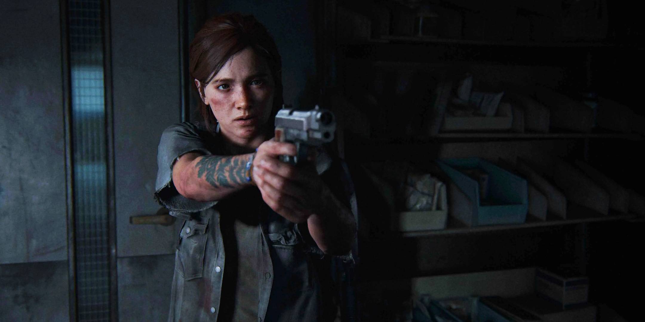 The Last of Us Part 2 - Ellie pointing a pistol, her tattoo visible.