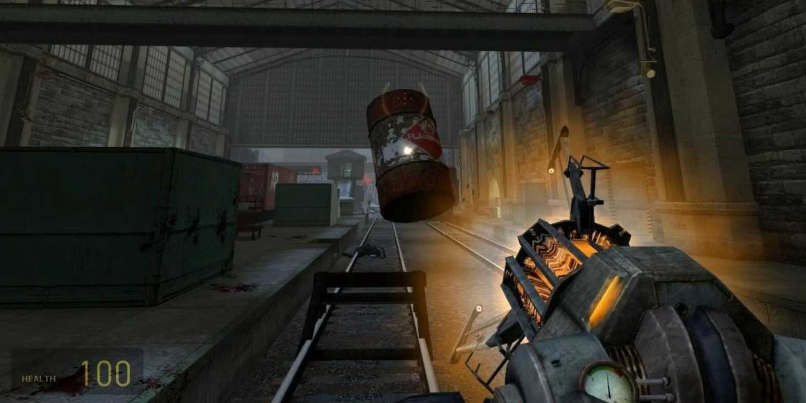 Picking up a red barrel with the Gravity Gun in Half-Life 2.