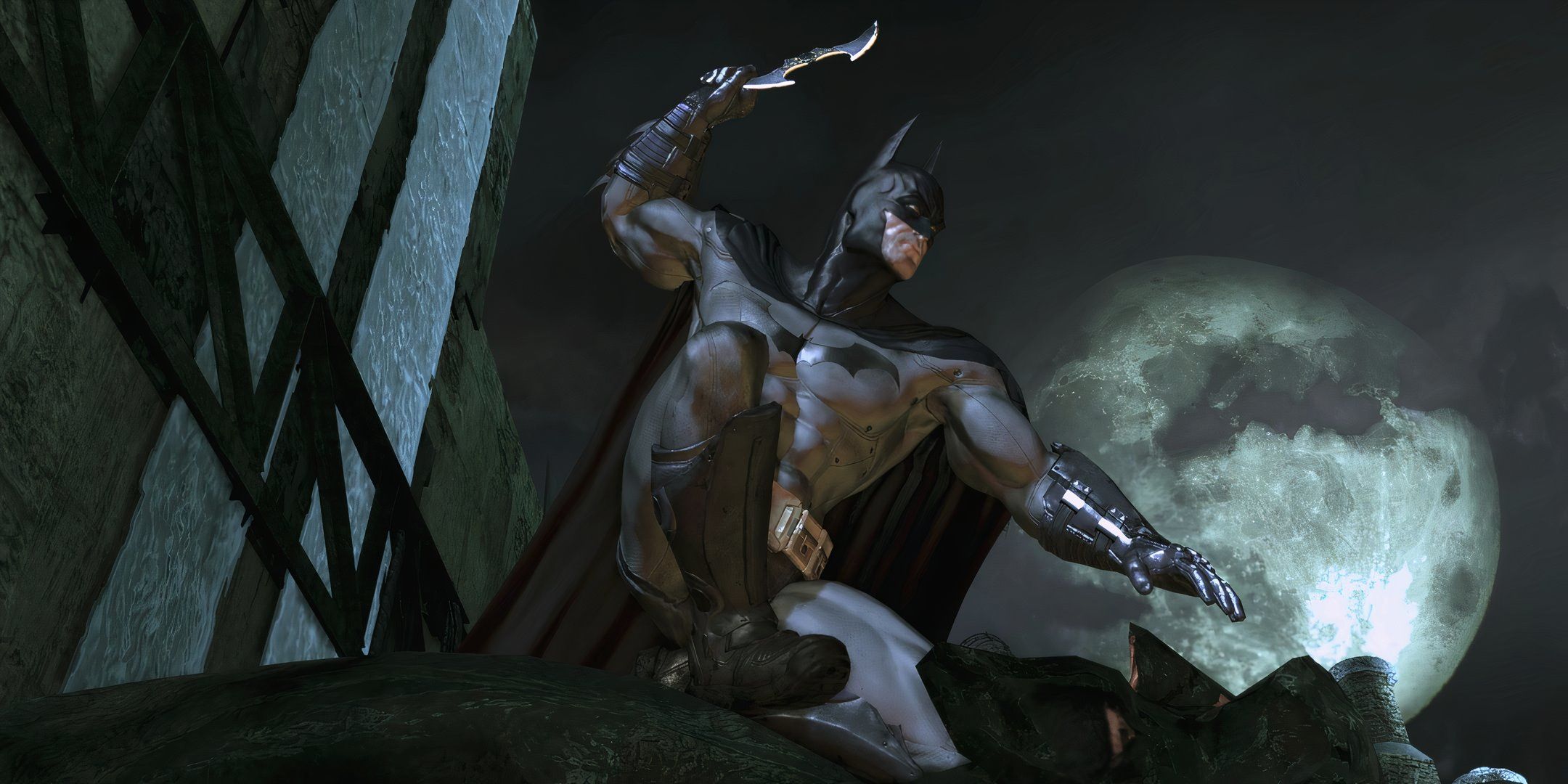 Batman on top of a building, with a batarang.