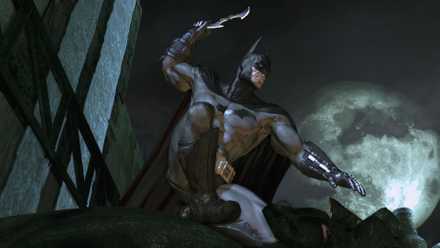 Batman on top of a building, with a batarang.