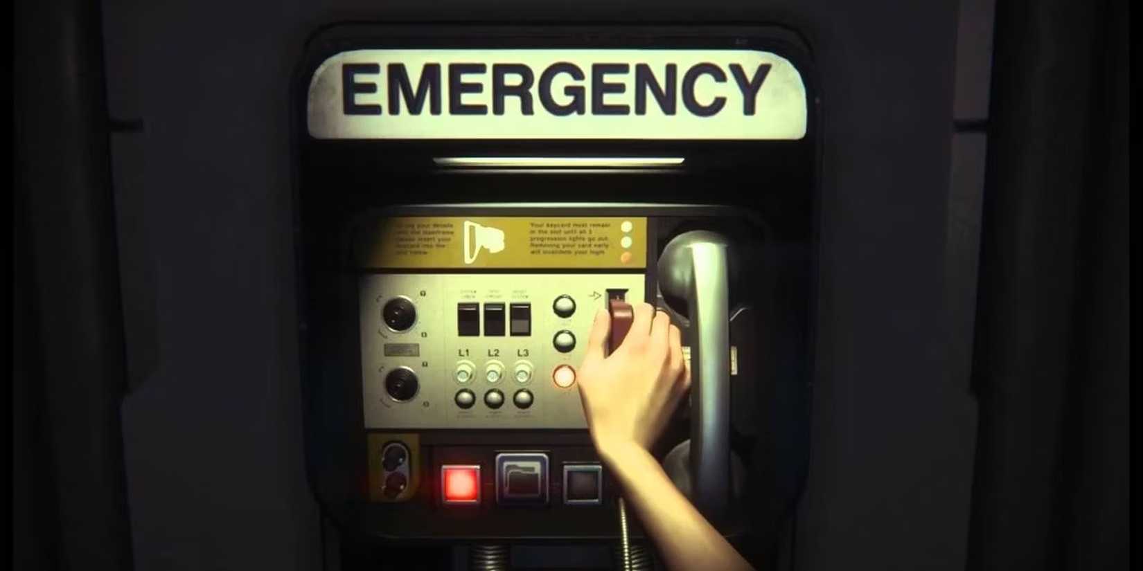 A player using an emergency phone that is hung on a wall to save in Alien: Isolation.