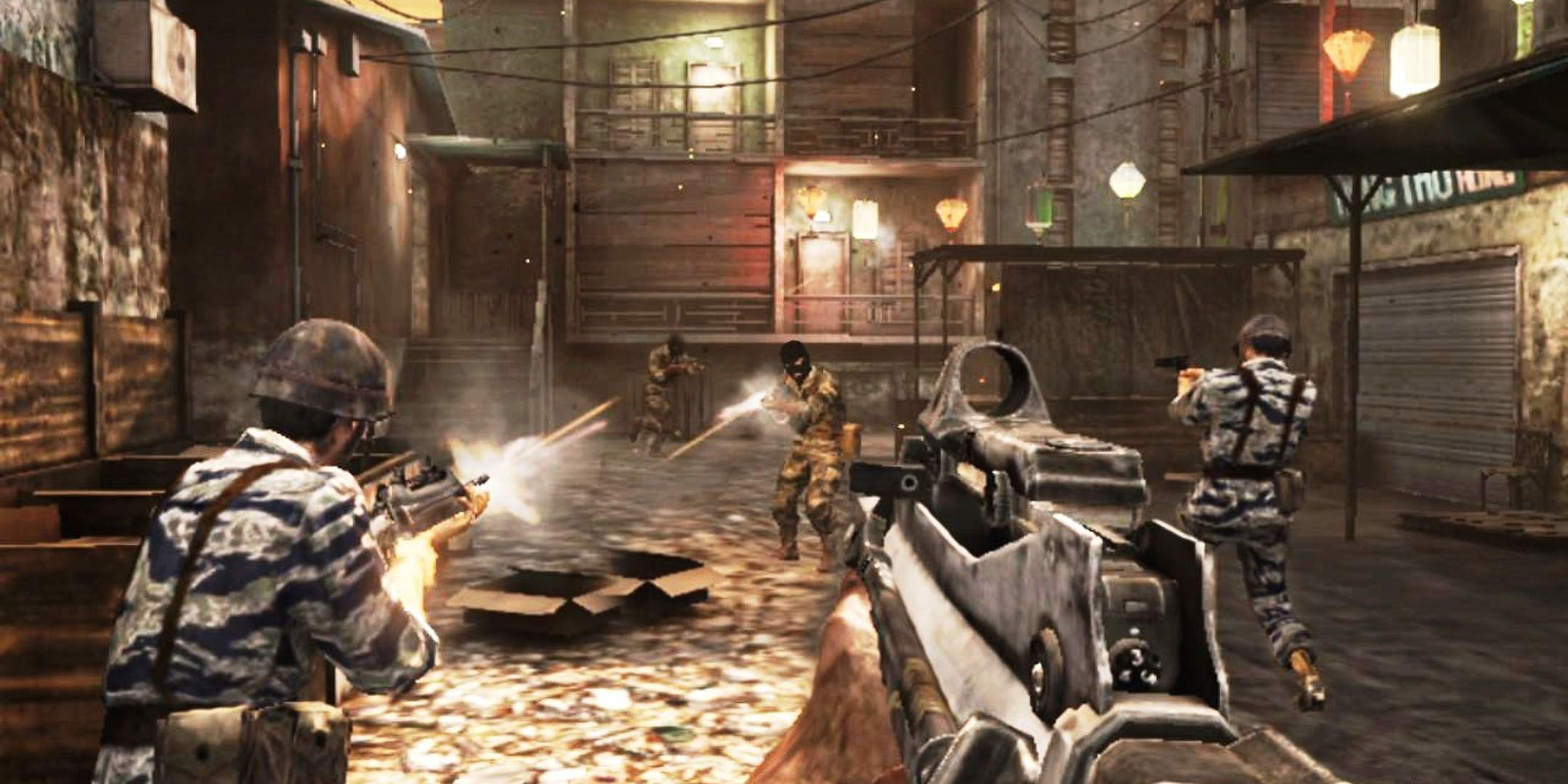 Black Ops Declassified screenshot of player pointing a FAMAS at enemies who are shooting at teammates.