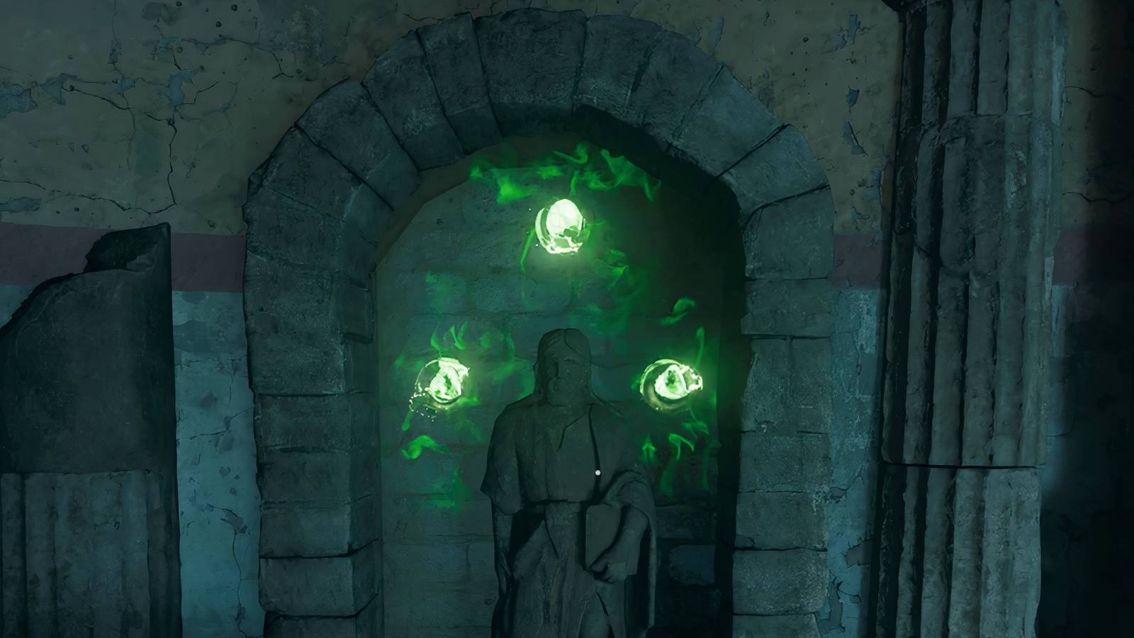 A picture of a statue with three green gems around it - bo6