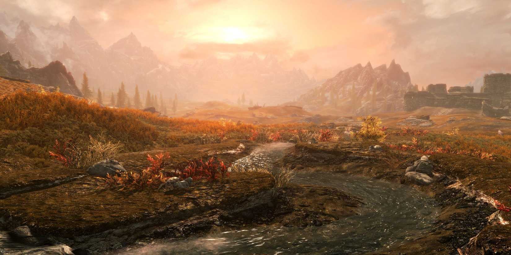 A tranquil stream on the sunset-lit plains in The Elder Scrolls 5: Skyrim.