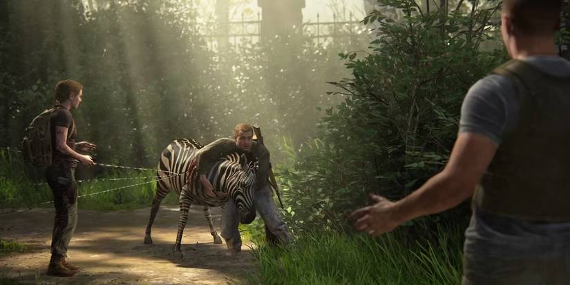Abby, Jerry, and Owen help save a zebra from a fence in The Last of Us Part II