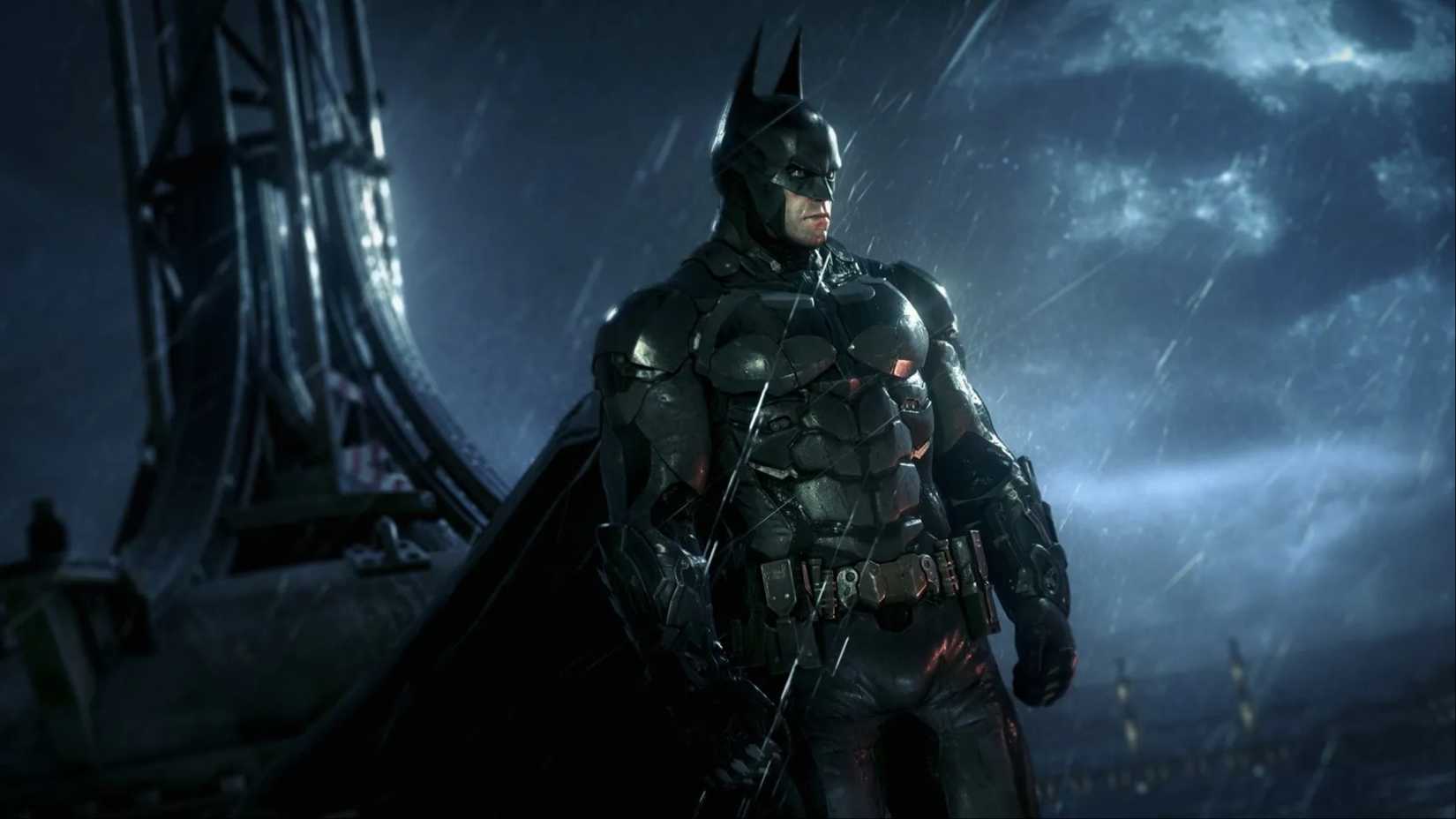 Batman standing on the rooftop in the pouring rain, looking out at the city in Batman: Arkham Knight.