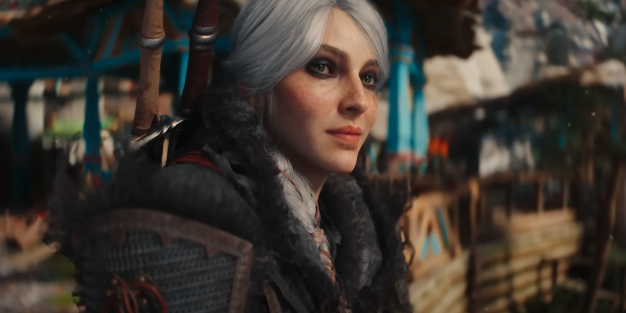 Ciri smiling in The Witcher 4. She has white hair and green eyes. She is dressed in dark clothes and has heavy makeup around her eyes.