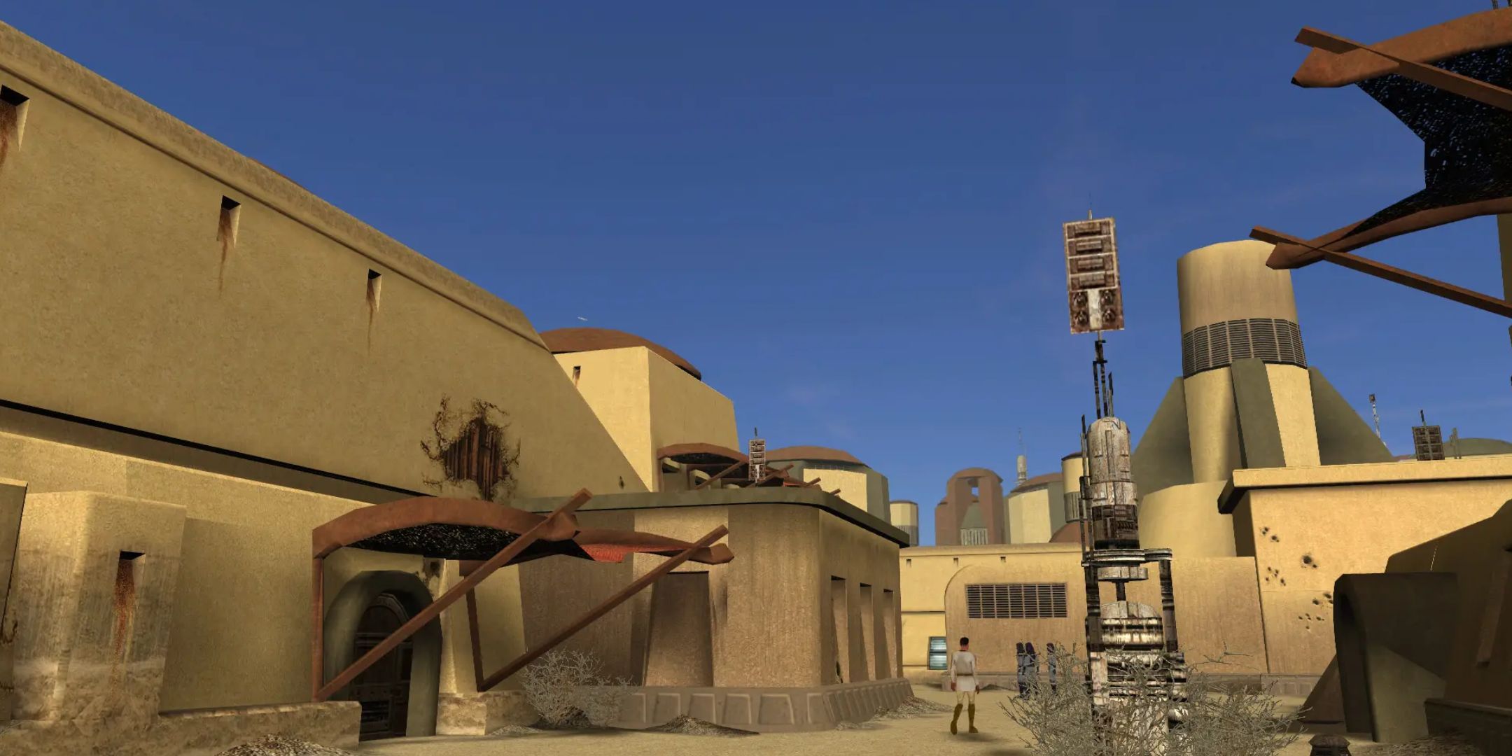A screenshot from a modded version of KOTOR, which improves the visuals. The screenshot shows a sandy planet with short, beige structures. The sky is perfectly blue