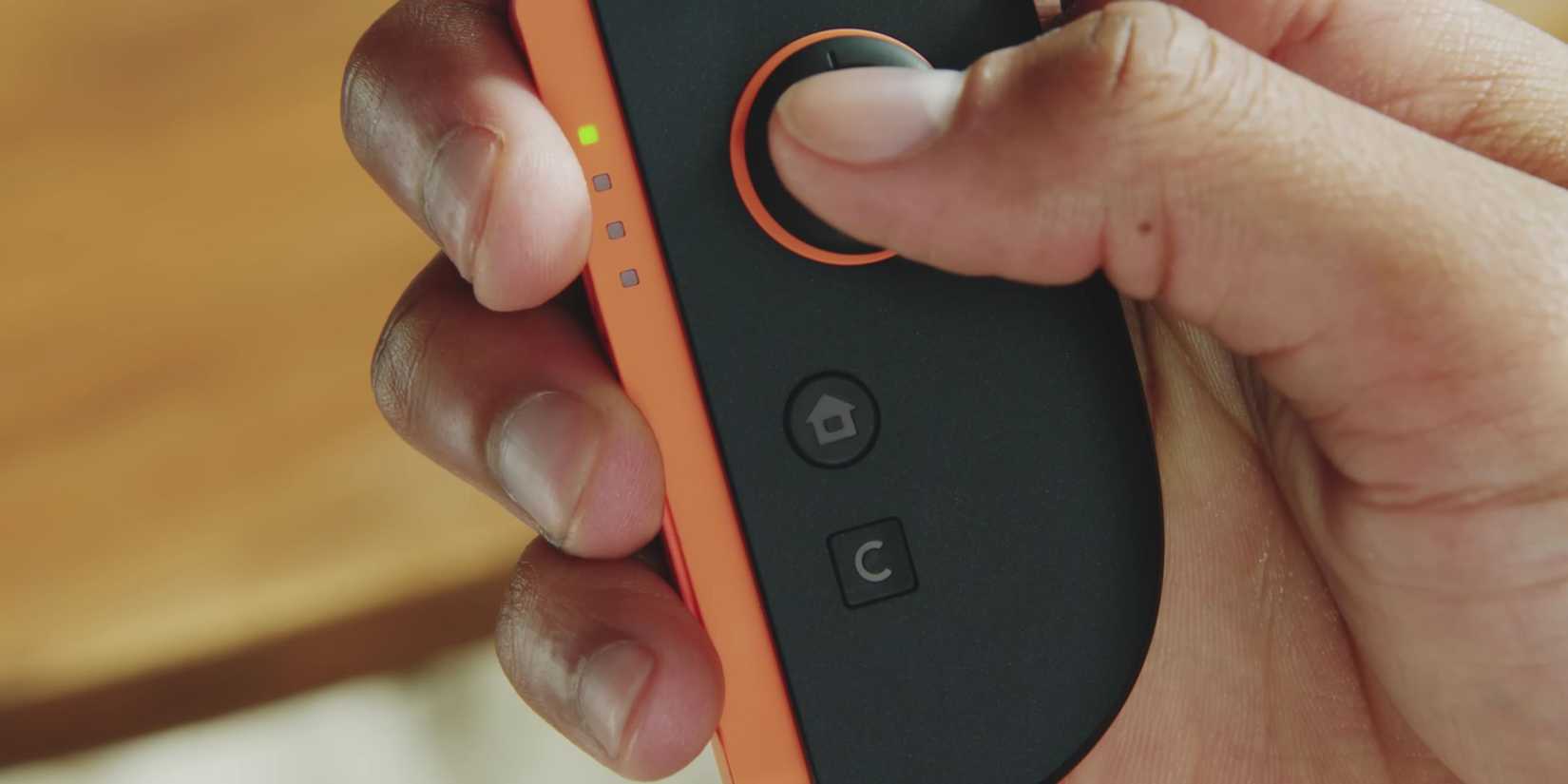 Someone about to press the Switch 2's C Button for GameChat.